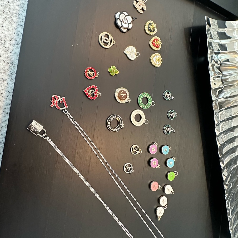 Authentic designer charms come with box and chain.